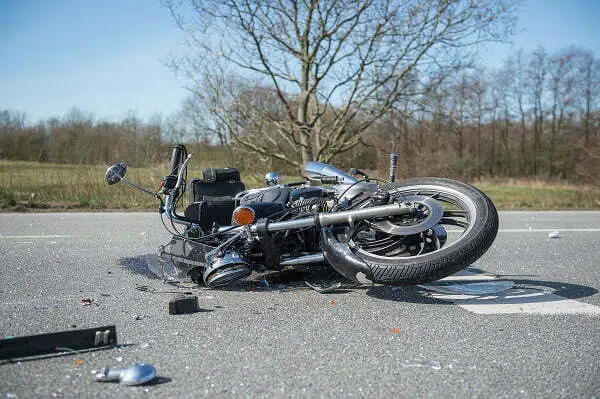 motorcycle laying on the highway after a motorcycle accident