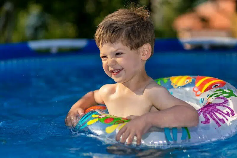 Child floating on pool in inflatable tube | Personal Injury Lawyer Karl Truman