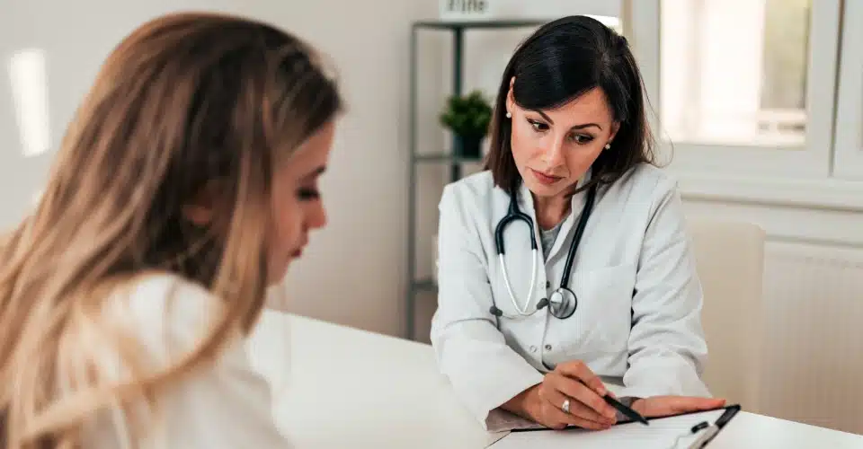 A woman meeting with a medical professional