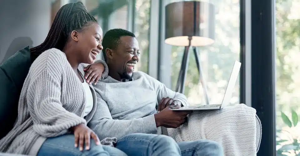 A couple interacting with legal counsel through video conference