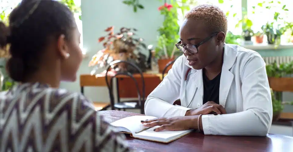 A woman meeting with a medical professional