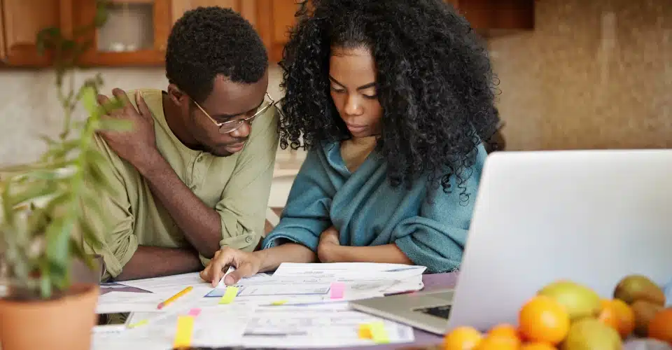 Two people reviewing paperwork