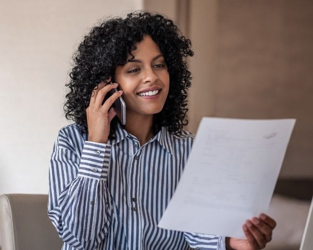a woman talking on the phone with a car accident attorney